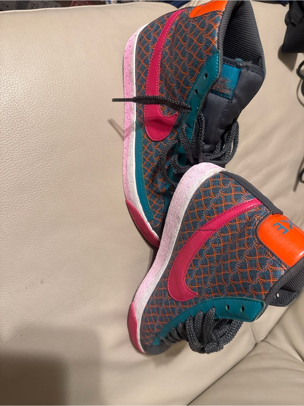 Nike Sneakers with Pink Swoosh and Teal